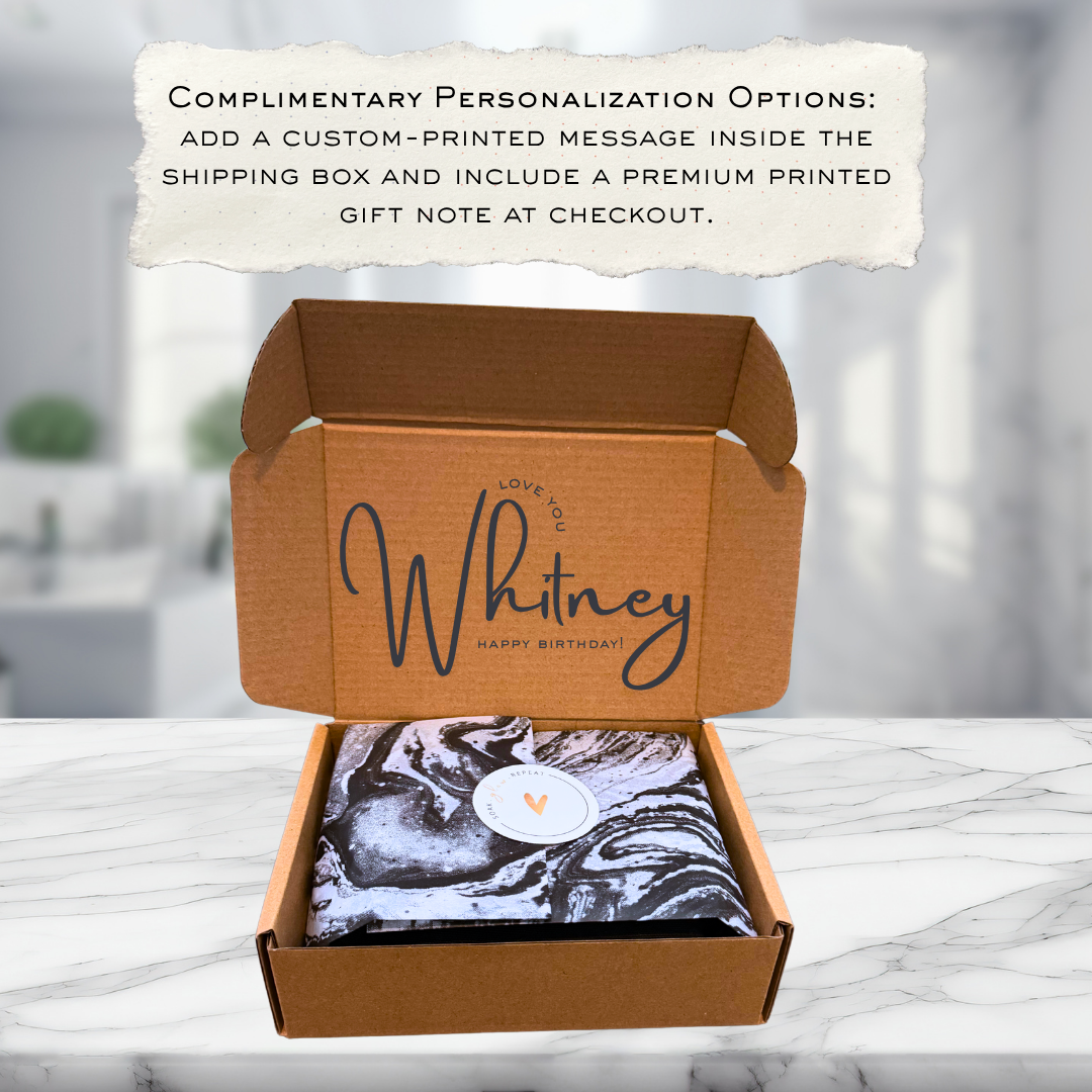 An open Partake Bodycare shipping box showing a personalized birthday message custom-printed on the inside lid.